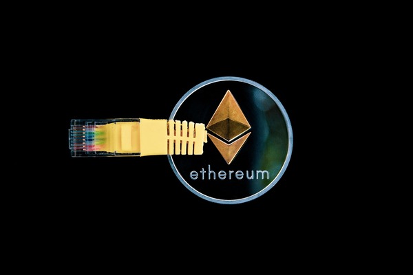 Ethereum coin connected to a network cable