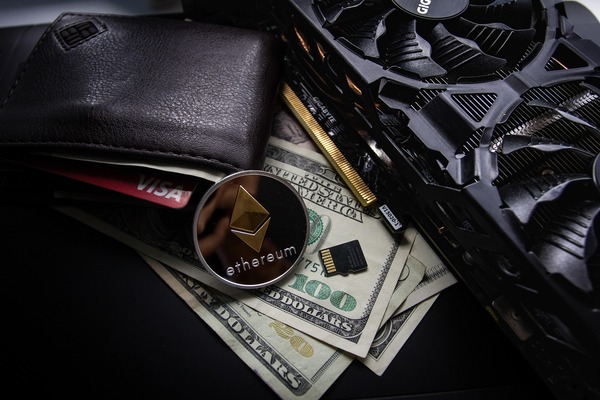 Ethereum coin in a wallet with dollar bills